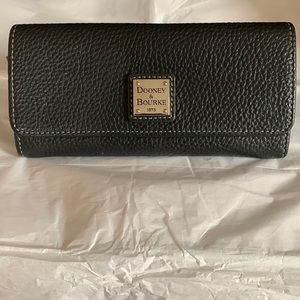 Black, pebble leather, women’s wallet by Dooney and Bourke.
